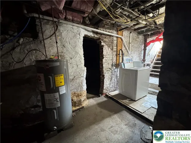 a view of an empty room with a fireplace