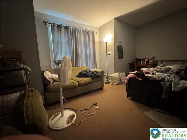 a hotel room with two beds and a couch