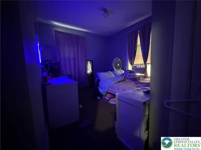 a view of a room with a refrigerator