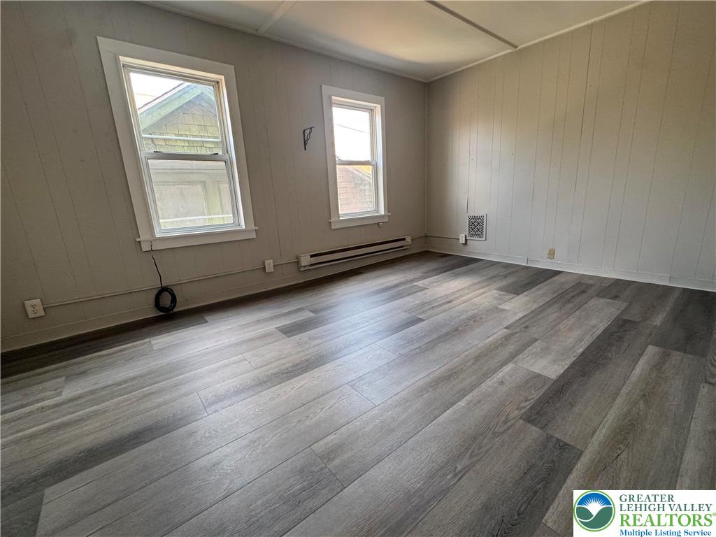 463 Montclair Avenue Bethlehem, PA 18015 - Photo 7 of 29 an empty room with wooden floor and windows