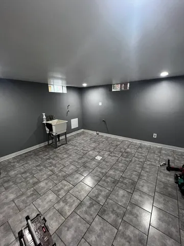 a bedroom with a bed and chair