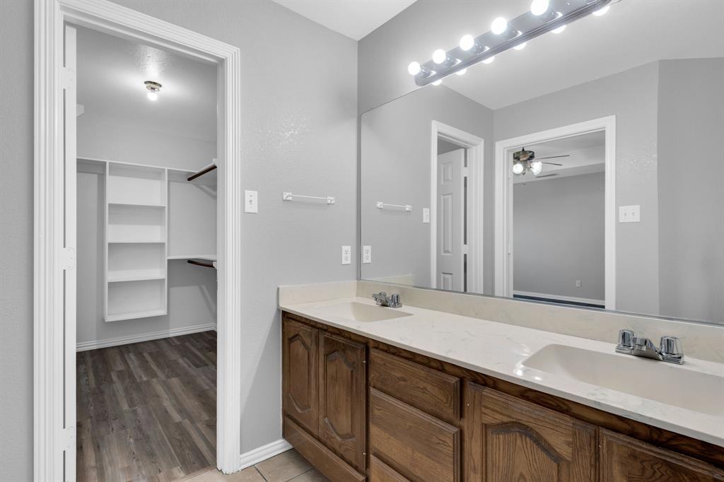 154 Richard Road Waxahachie, TX 75167 - Photo 11 of 38 a bathroom with a sink and a mirror