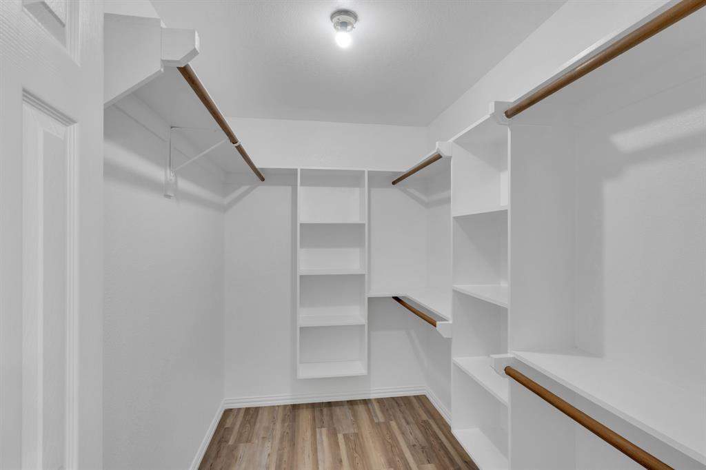 154 Richard Road Waxahachie, TX 75167 - Photo 14 of 38 a view of walk in closet with empty racks