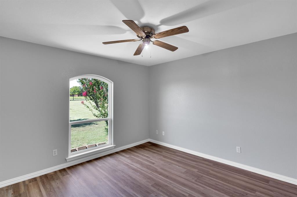 154 Richard Road Waxahachie, TX 75167 - Photo 16 of 38 wooden floor in an empty room with a window