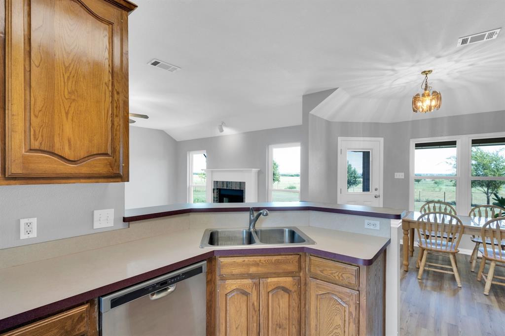 154 Richard Road Waxahachie, TX 75167 - Photo 25 of 38 a kitchen with a sink cabinets and window