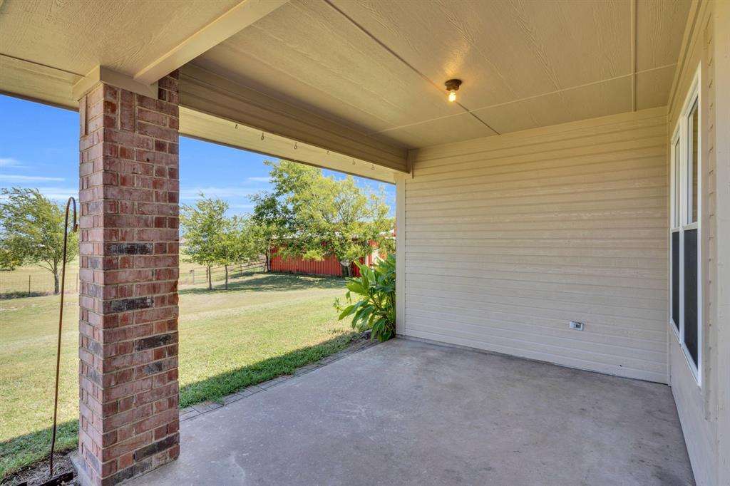 154 Richard Road Waxahachie, TX 75167 - Photo 30 of 38 a view of a room with wooden floor and a porch