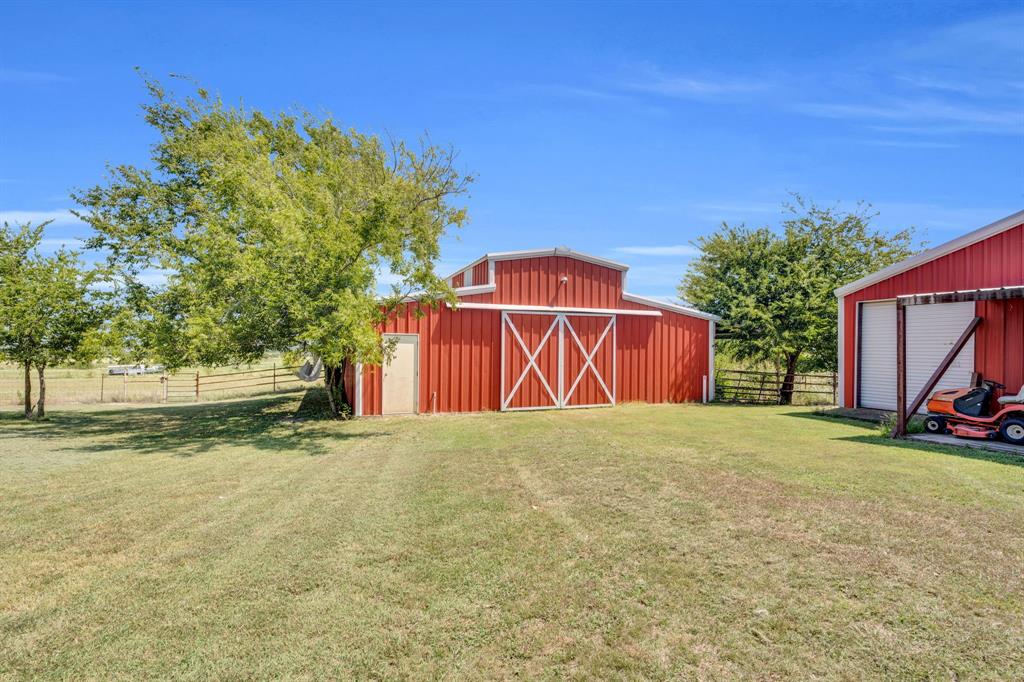 154 Richard Road Waxahachie, TX 75167 - Photo 33 of 38 a view of a house with a yard and garage