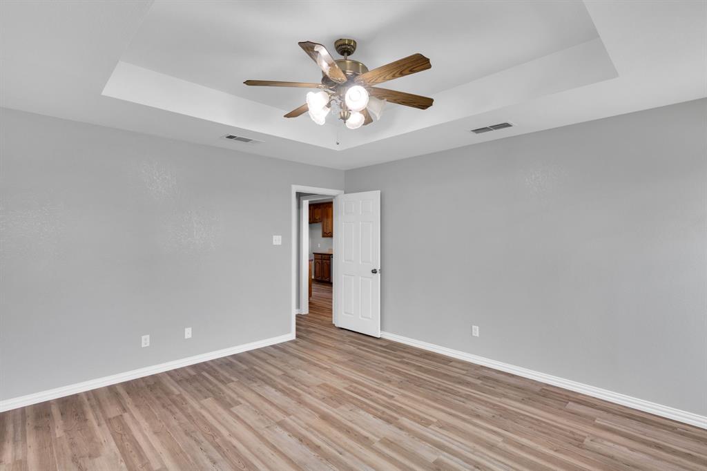154 Richard Road Waxahachie, TX 75167 - Photo 9 of 38 a view of an empty room with window and a ceiling fan