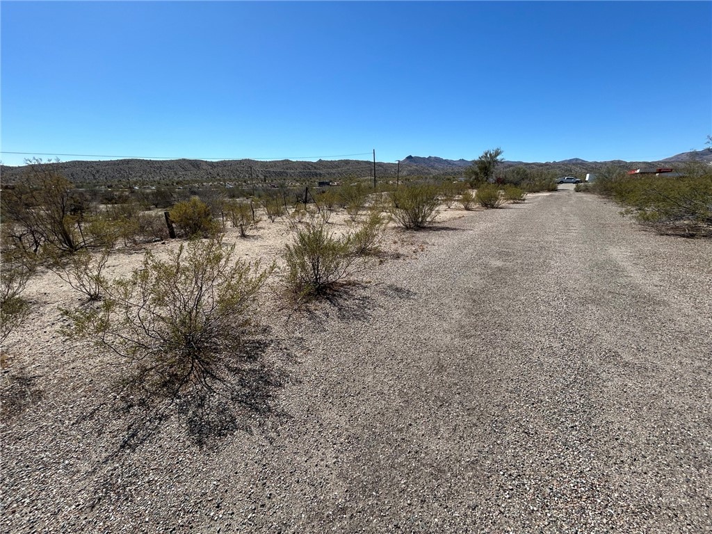 93 Wikieup Az 85360 Wikieup, AZ 85360 - Photo 1 of 6 View of dirt / gravel road featuring a rural view and a mountain view