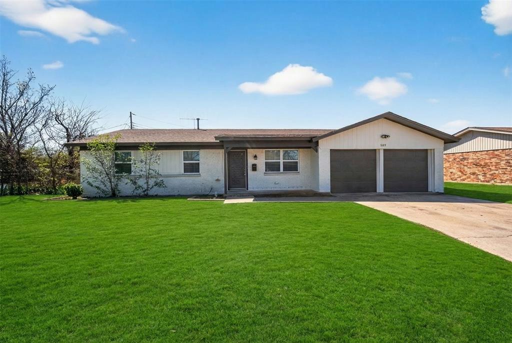 809 Michelle Drive Everman, TX 76140 - Photo 1 of 1 a front view of a house with a garden and yard