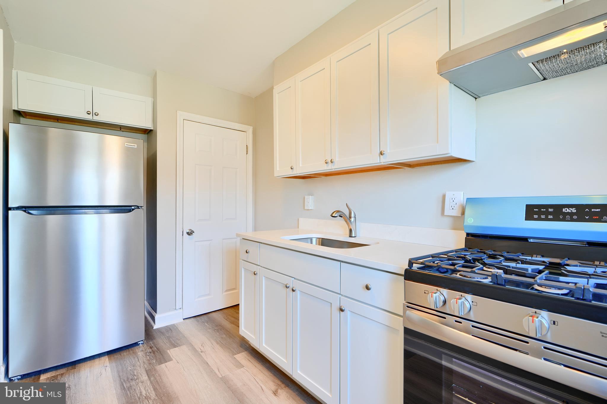 406 Torner Road Baltimore, MD 21221 - Photo 14 of 35 a kitchen with stainless steel appliances granite countertop a refrigerator stove and sink