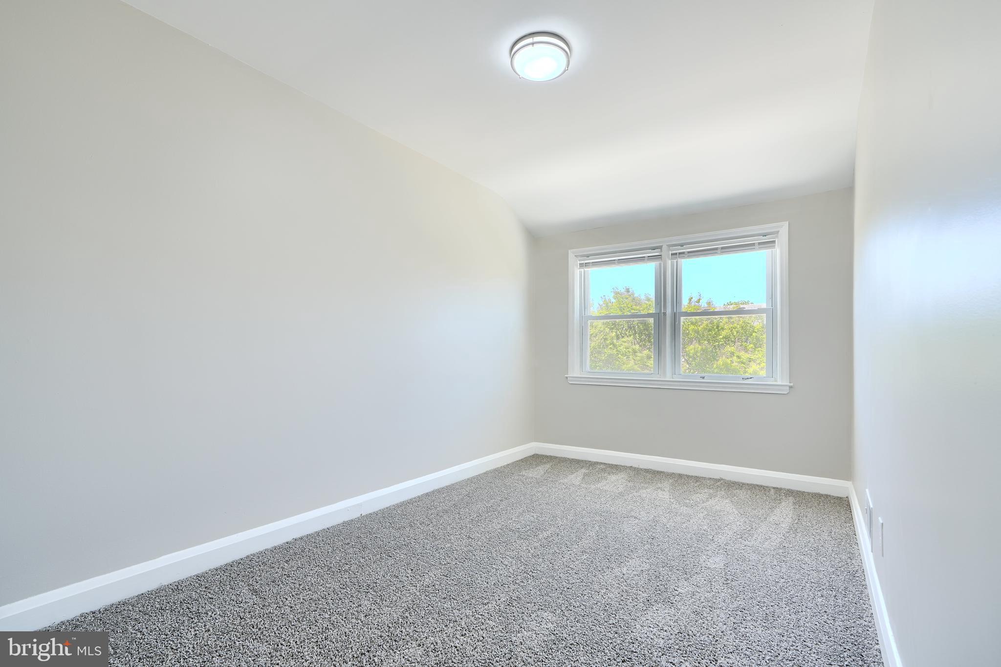 406 Torner Road Baltimore, MD 21221 - Photo 21 of 35 an empty room with a window