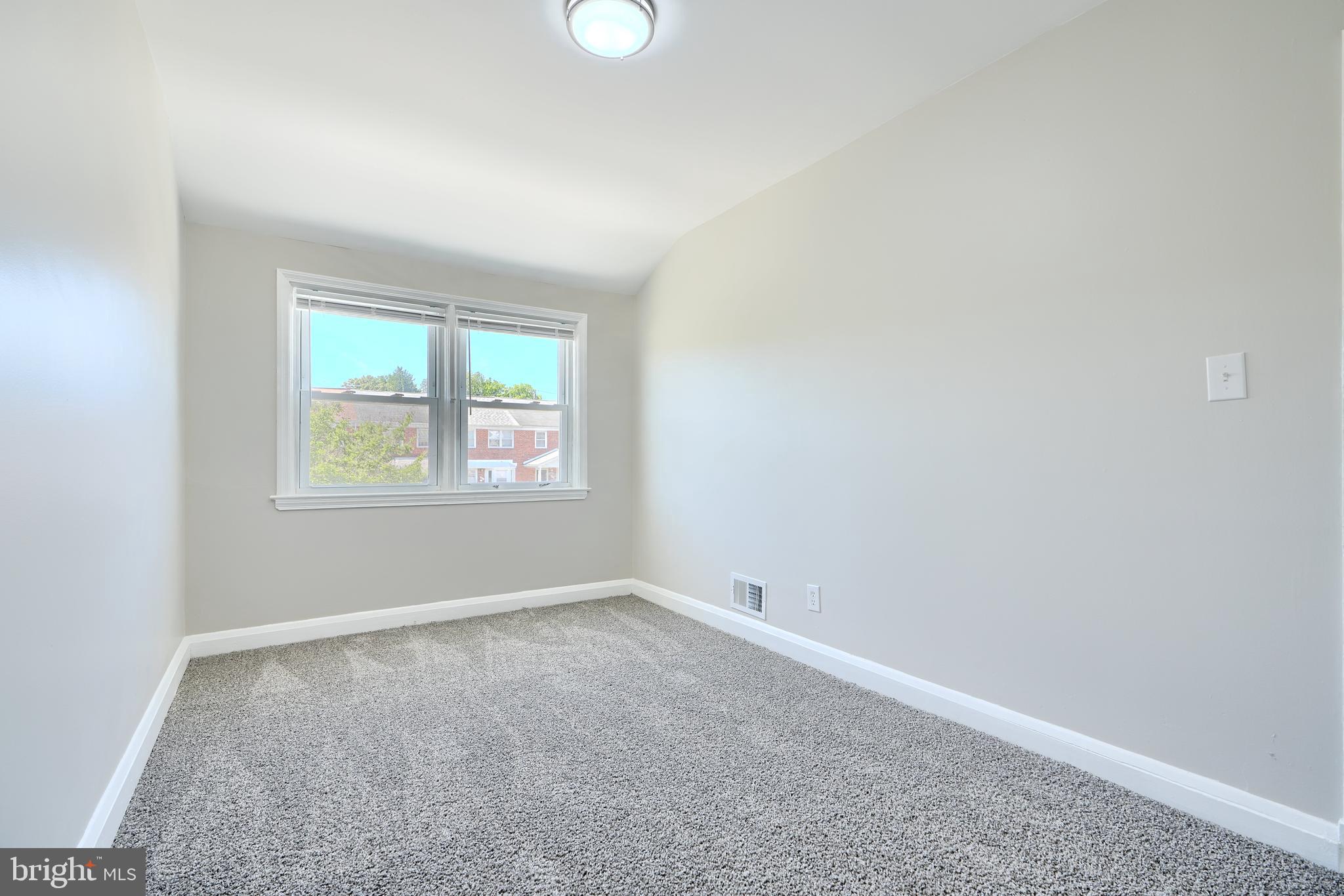 406 Torner Road Baltimore, MD 21221 - Photo 22 of 35 an empty room with a window
