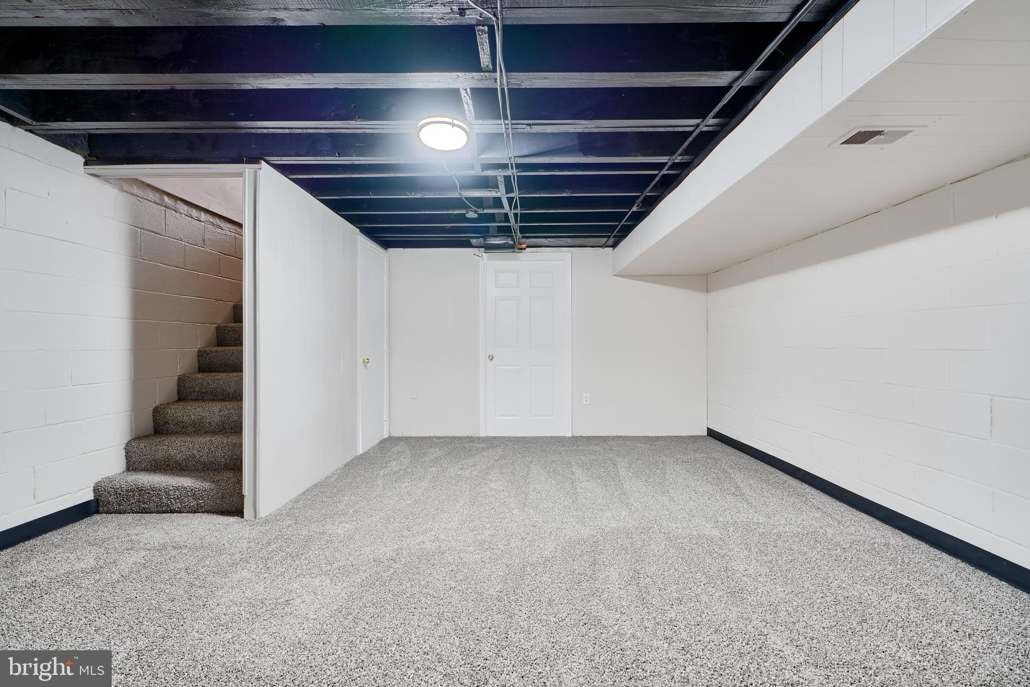 406 Torner Road Baltimore, MD 21221 - Photo 29 of 35 a view of an empty room with stairs