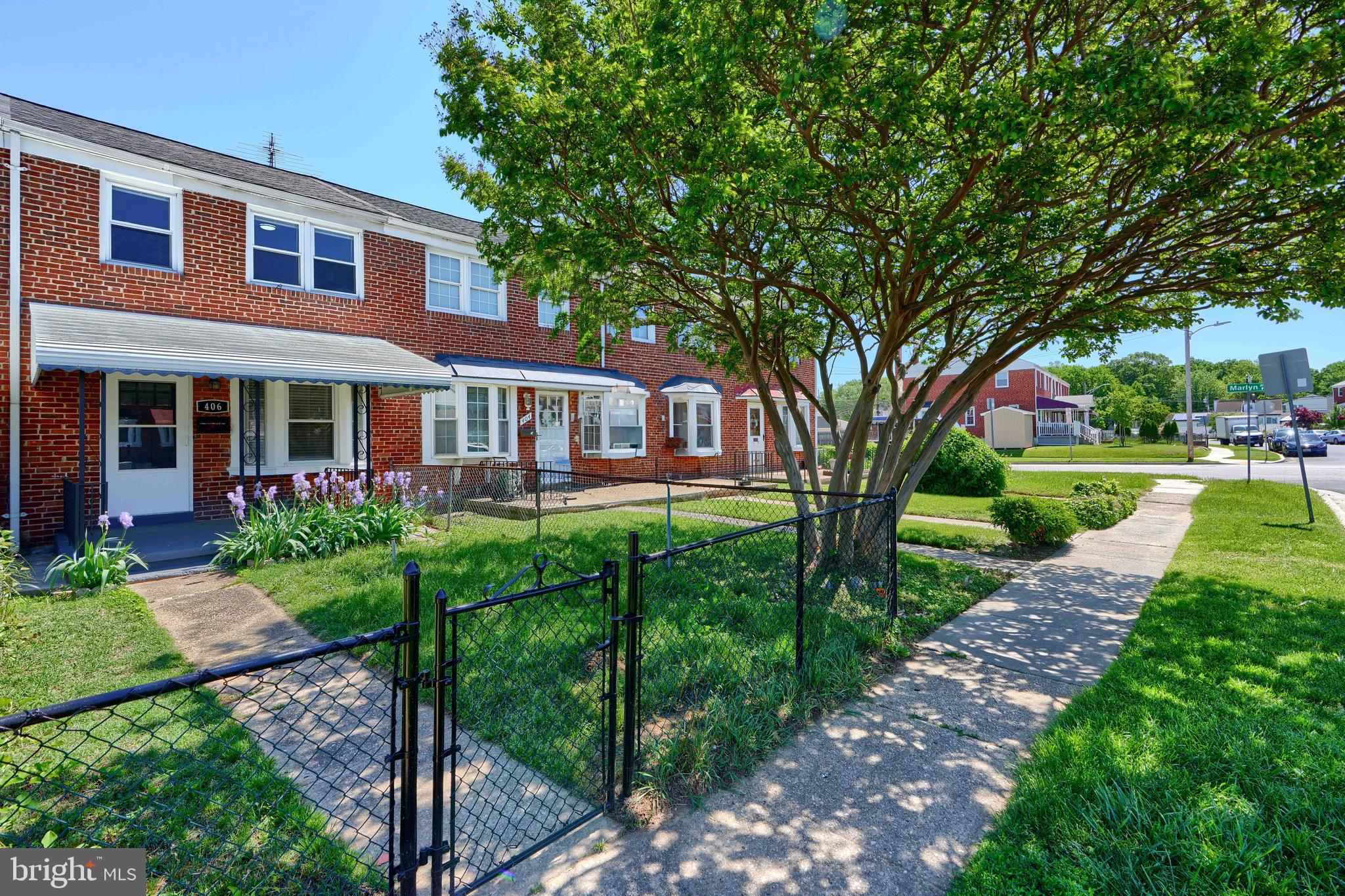 406 Torner Road Baltimore, MD 21221 - Photo 3 of 35 a front view of a house with a yard table and chairs