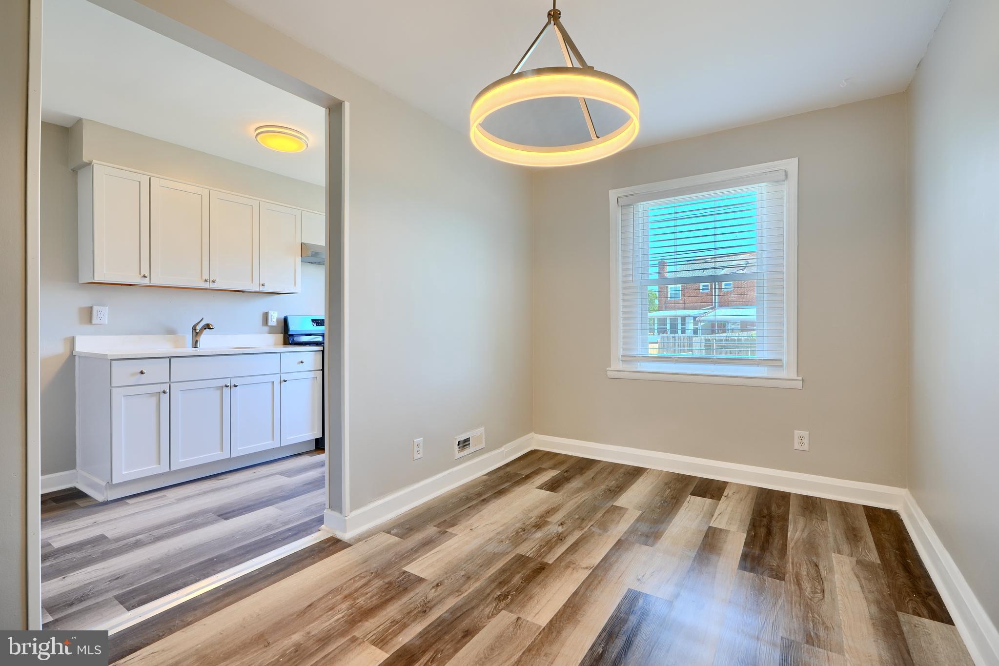 406 Torner Road Baltimore, MD 21221 - Photo 9 of 35 a view of kitchen and wooden floor