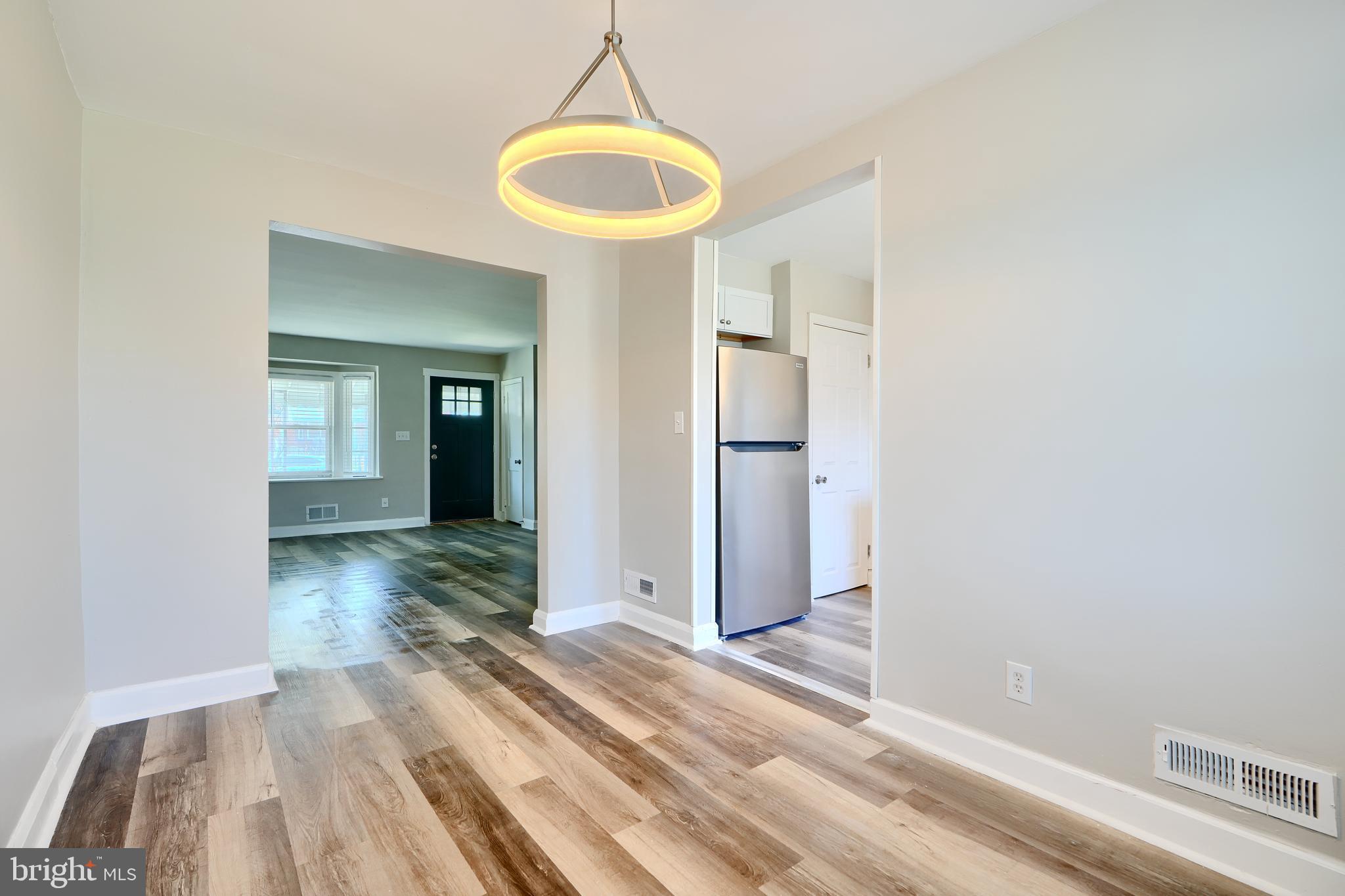 406 Torner Road Baltimore, MD 21221 - Photo 10 of 35 a view of a room with wooden floor and a window