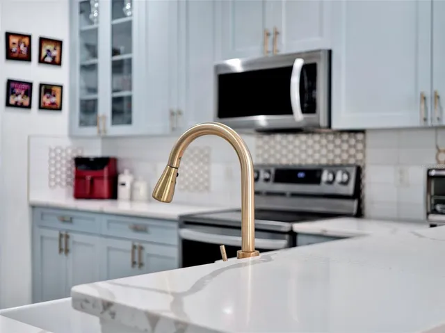 a kitchen with a microwave and cabinets