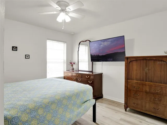 a bedroom with a bed and a dresser