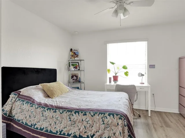 a bedroom with a bed and a table in it