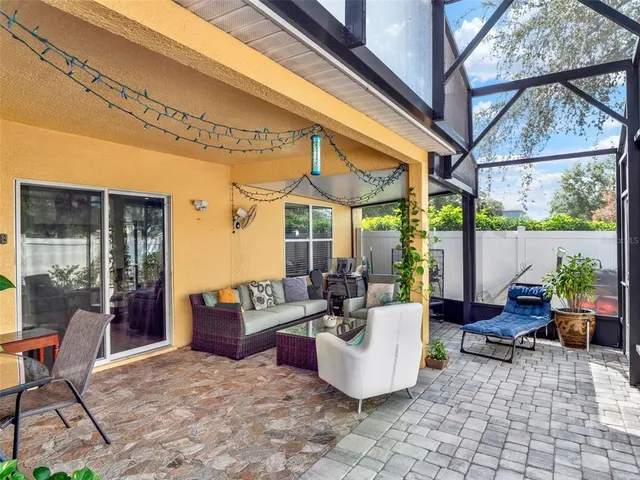 a outdoor space with patio furniture and potted plants