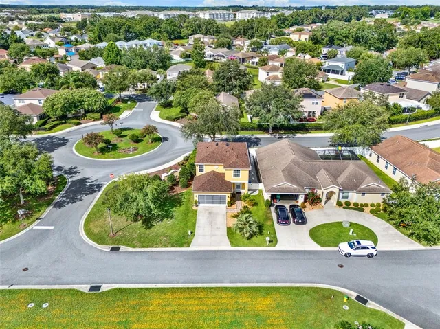 an aerial view of house with yard swimming pool and outdoor seating