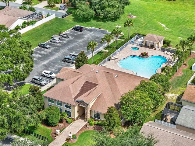 an aerial view of a house with outdoor space