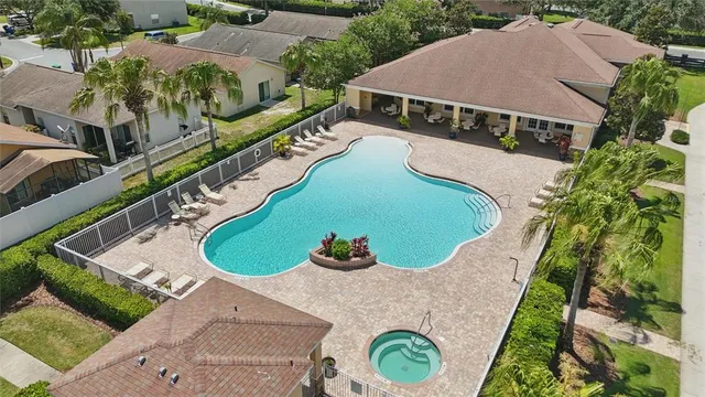 an aerial view of a house with outdoor space