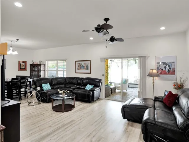 a living room with furniture window and wooden floor