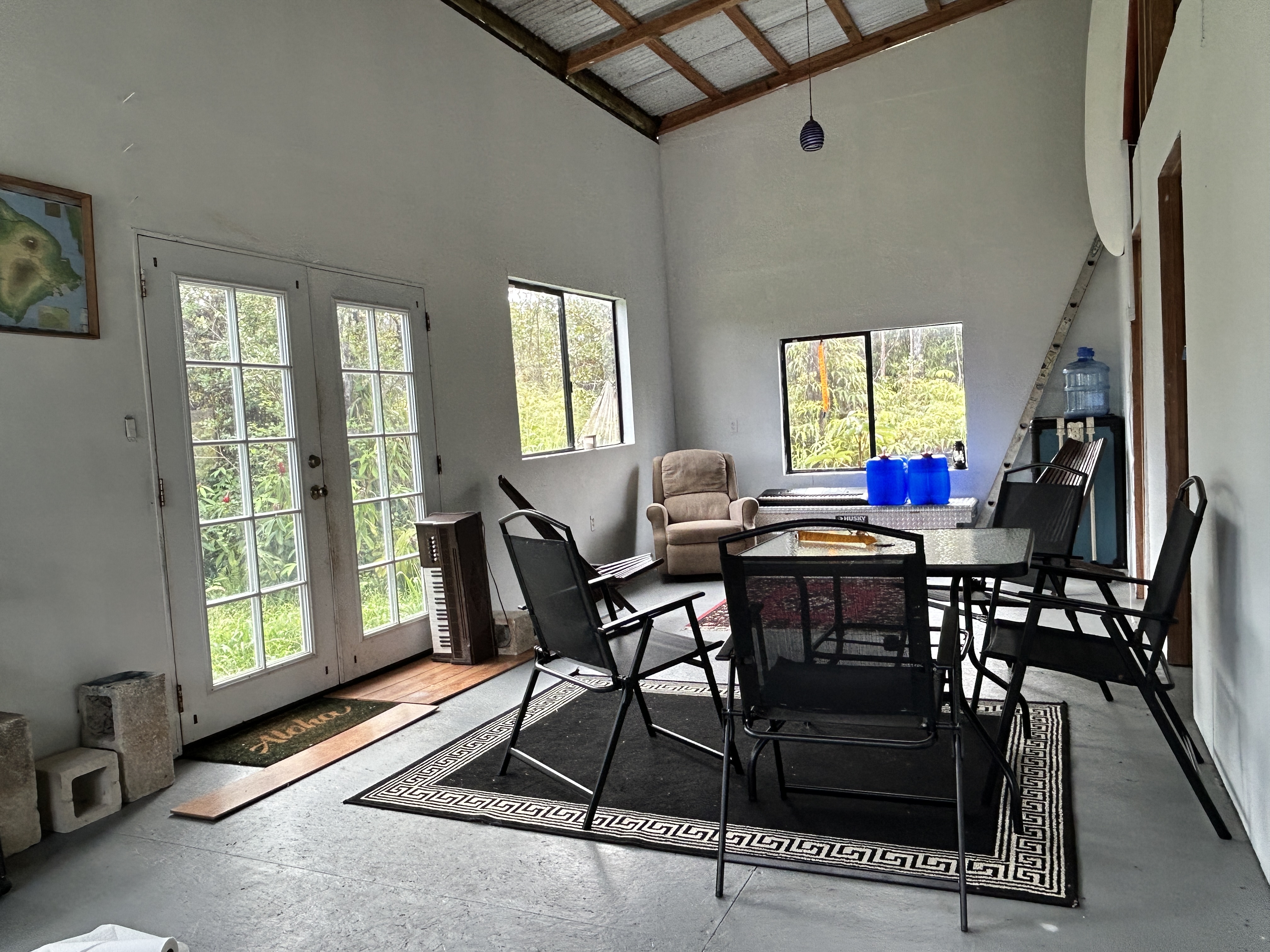 11-1834 Kolea Street Mountain View, HI 96771 - Photo 12 of 30 a view of a dining room with furniture and a window