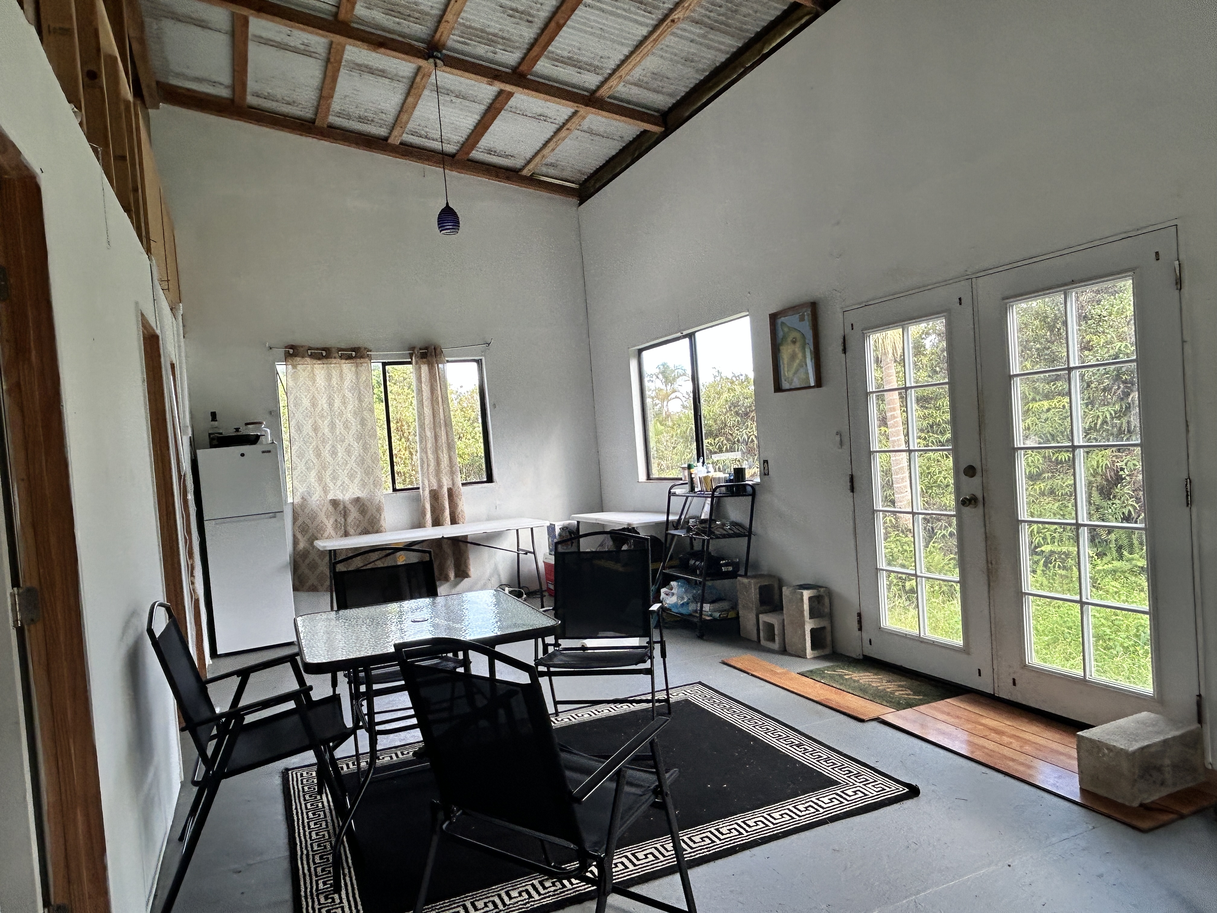 11-1834 Kolea Street Mountain View, HI 96771 - Photo 20 of 30 a outdoor space with furniture and large windows