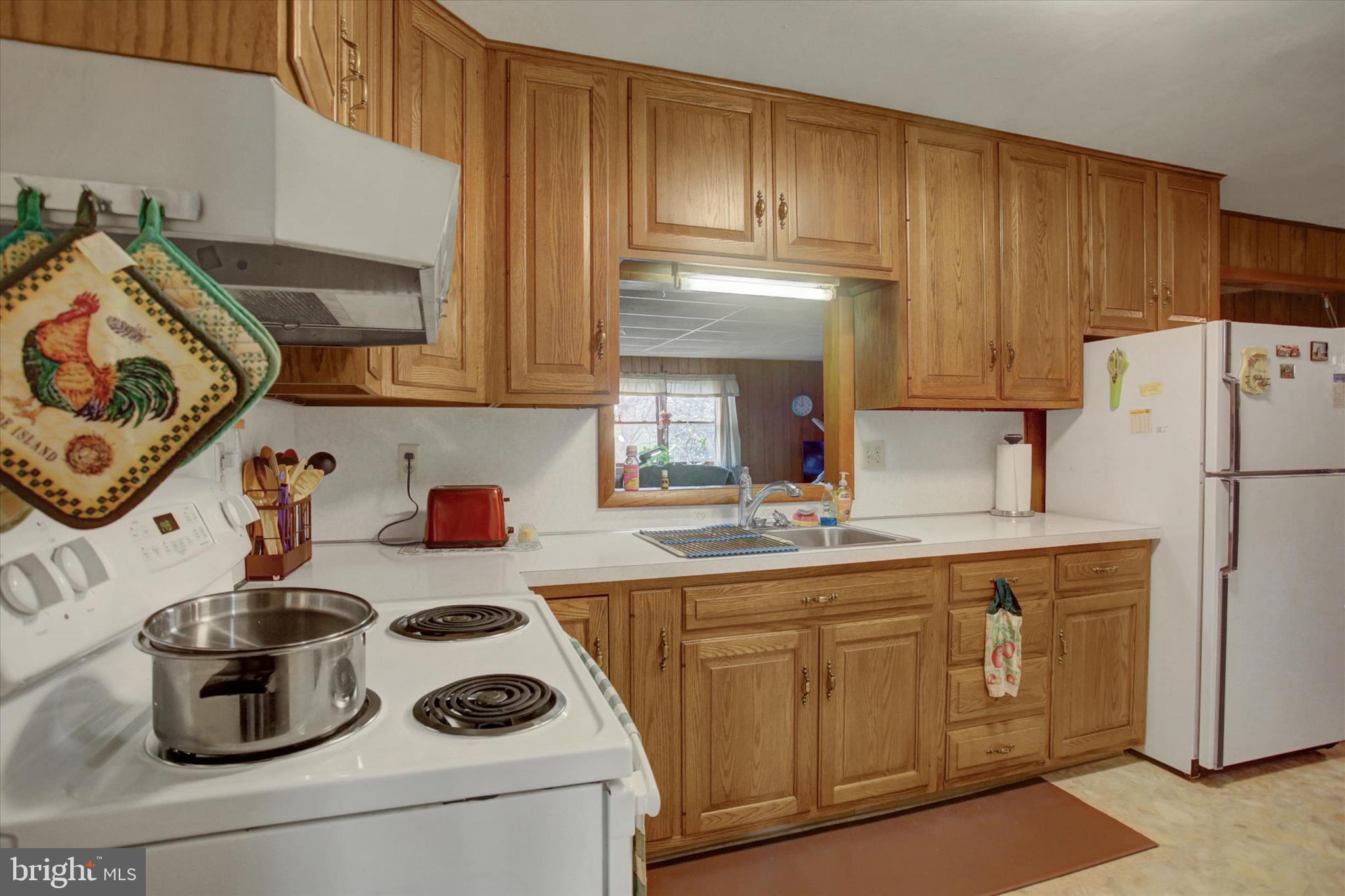 2165 Hafer Road Fayetteville, PA 17222 - Photo 12 of 35 a kitchen with a sink a stove and cabinets