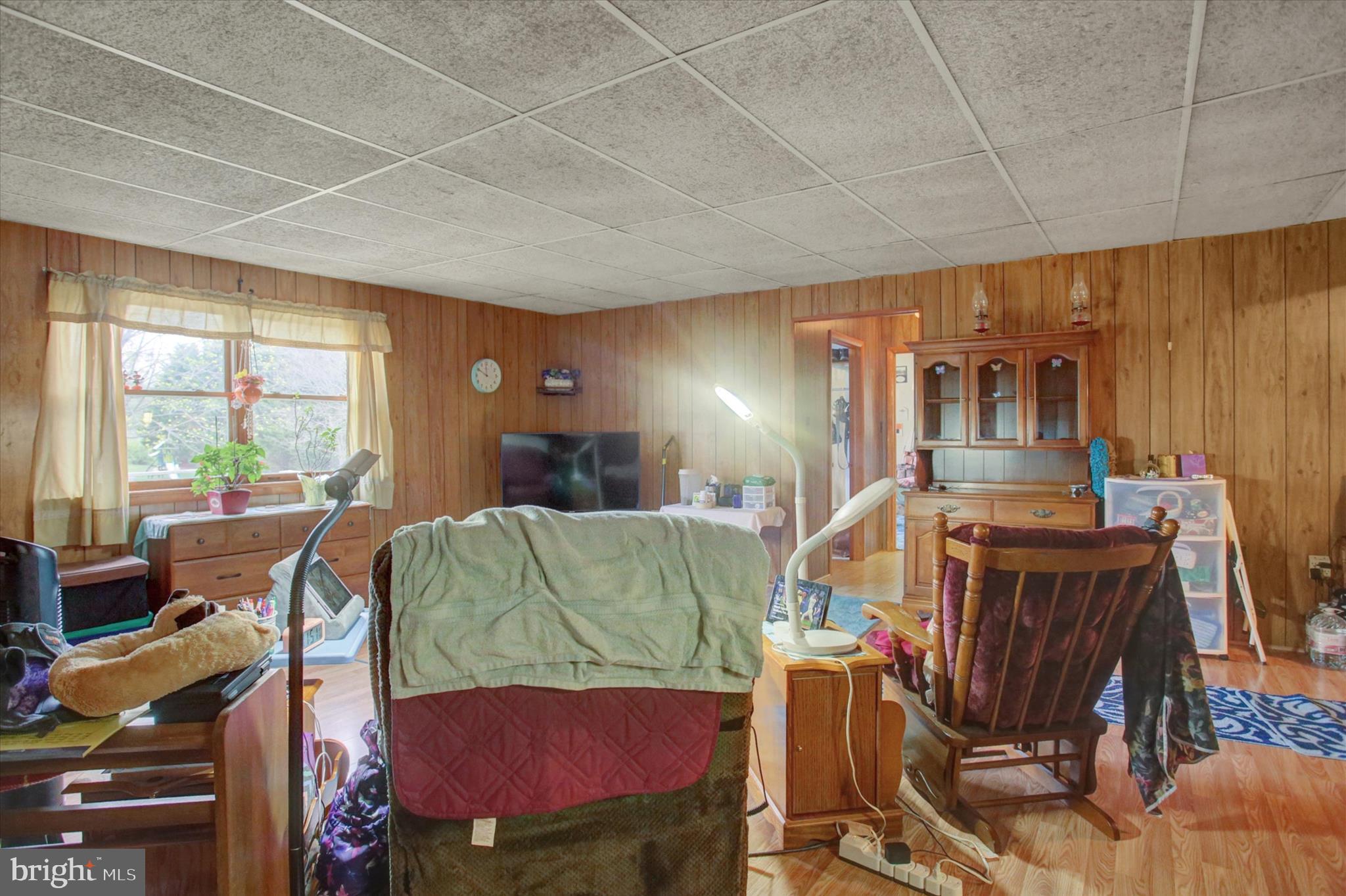 2165 Hafer Road Fayetteville, PA 17222 - Photo 25 of 35 a living room with furniture a flat screen tv and floor to ceiling window