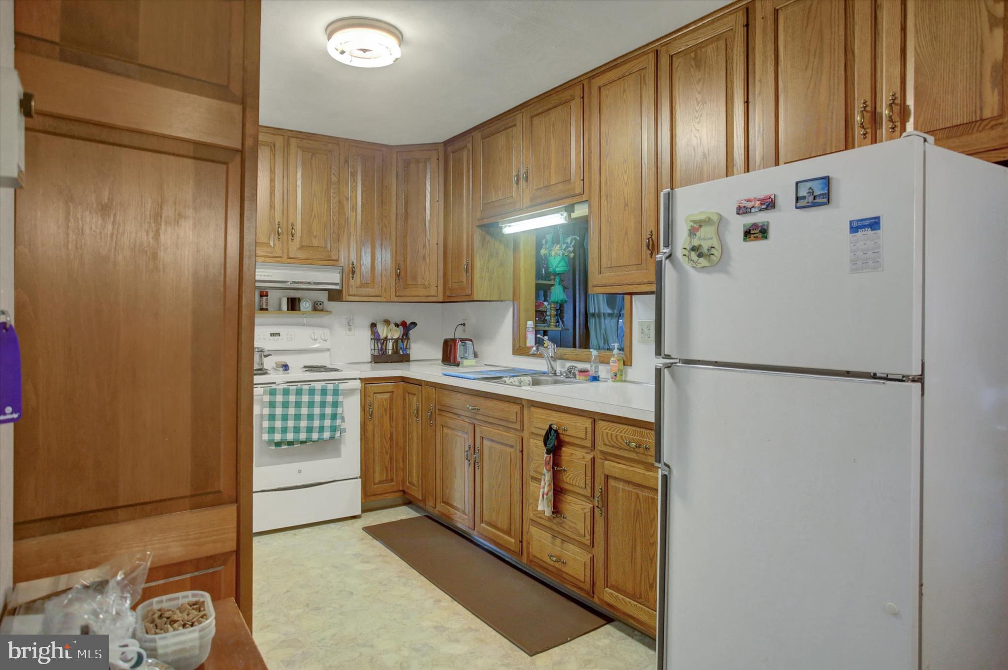 2165 Hafer Road Fayetteville, PA 17222 - Photo 9 of 35 a white refrigerator freezer sitting inside of a kitchen