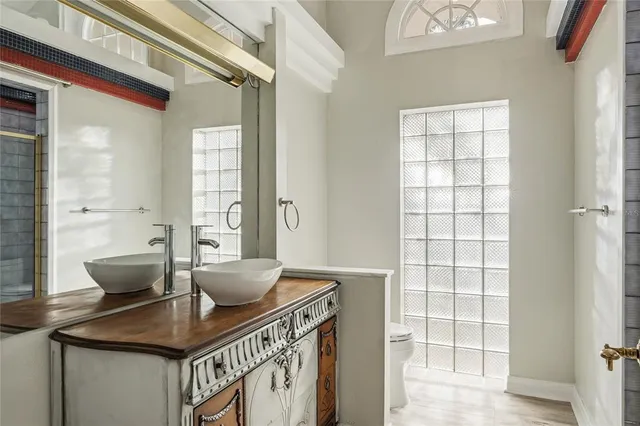 a view of a kitchen area with furniture and wooden floor