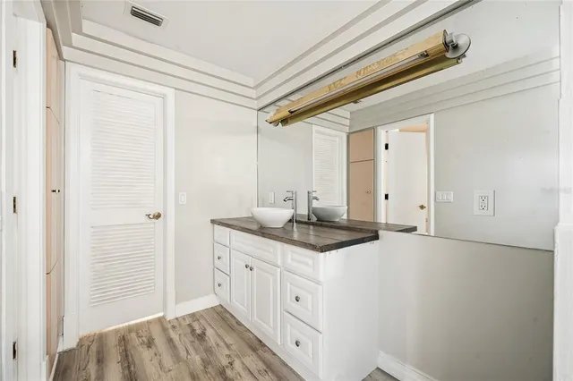 a kitchen with a sink and cabinets