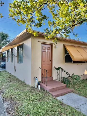 a backyard of a house with lots of green space