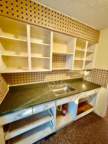 a bed room with a bed and a television