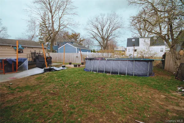 a view of a backyard with a large tree