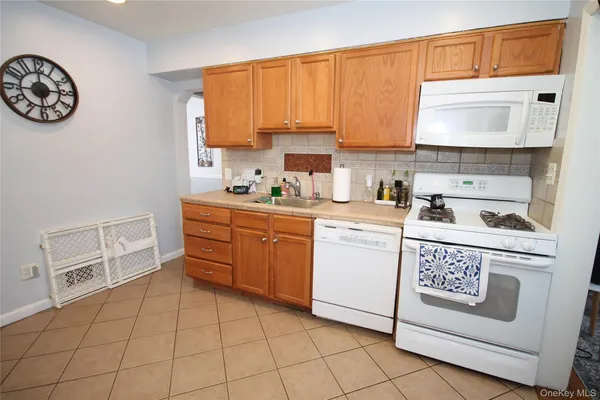 a kitchen with a cabinets and window