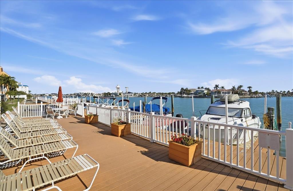 a view of a balcony with wooden floor and city view