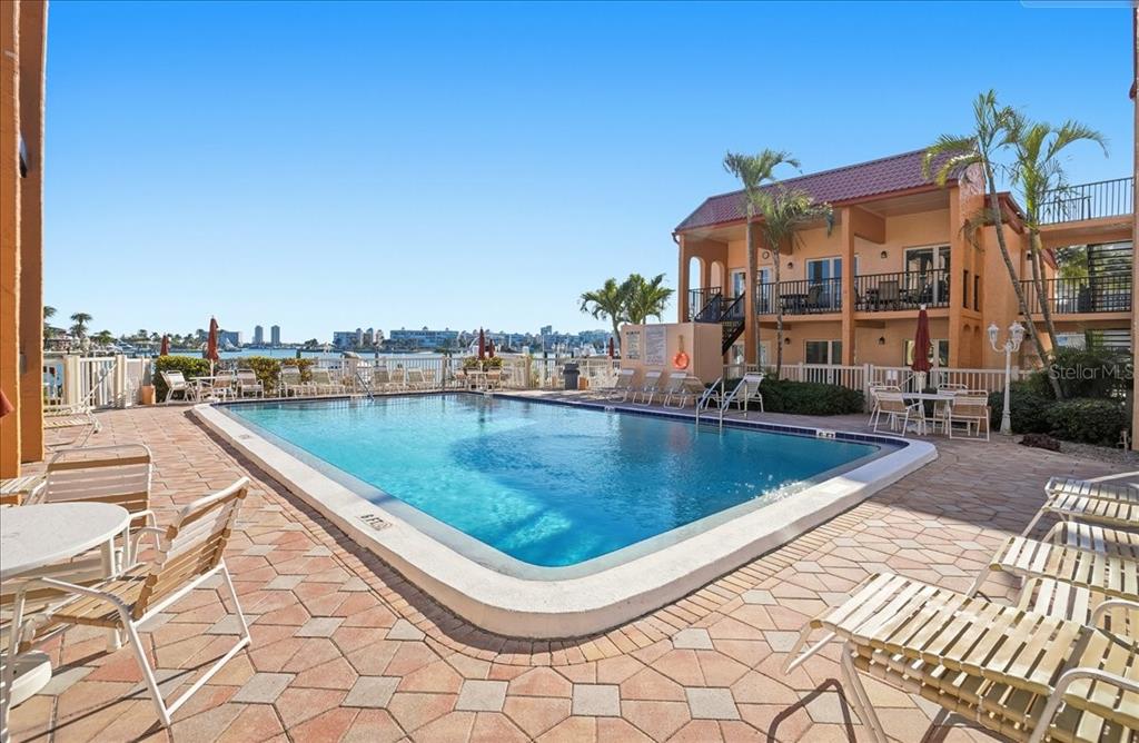 8931 Blind Pass Road, Unit 360 St. Pete Beach, FL 33706 - Photo 18 of 20 a view of swimming pool with a terrace