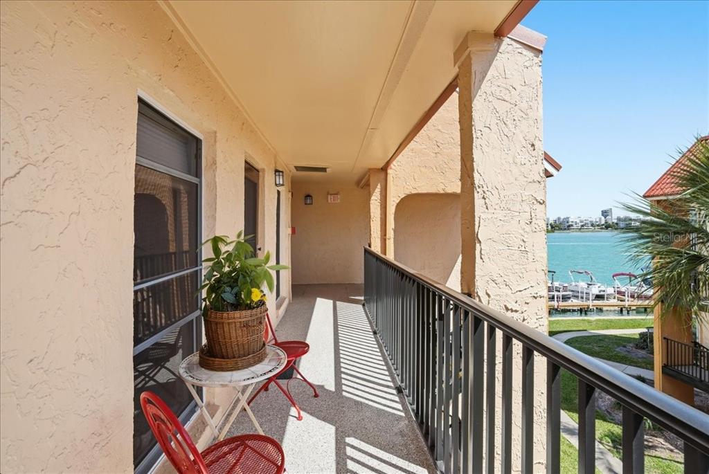 8931 Blind Pass Road, Unit 360 St. Pete Beach, FL 33706 - Photo 2 of 20 a view of balcony with furniture