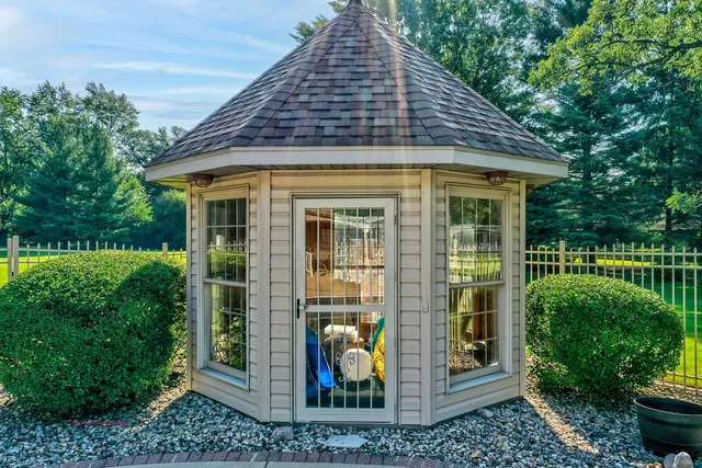 a front view of a house with garden