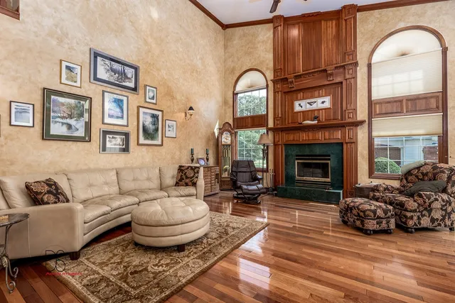 a living room with furniture and a fireplace