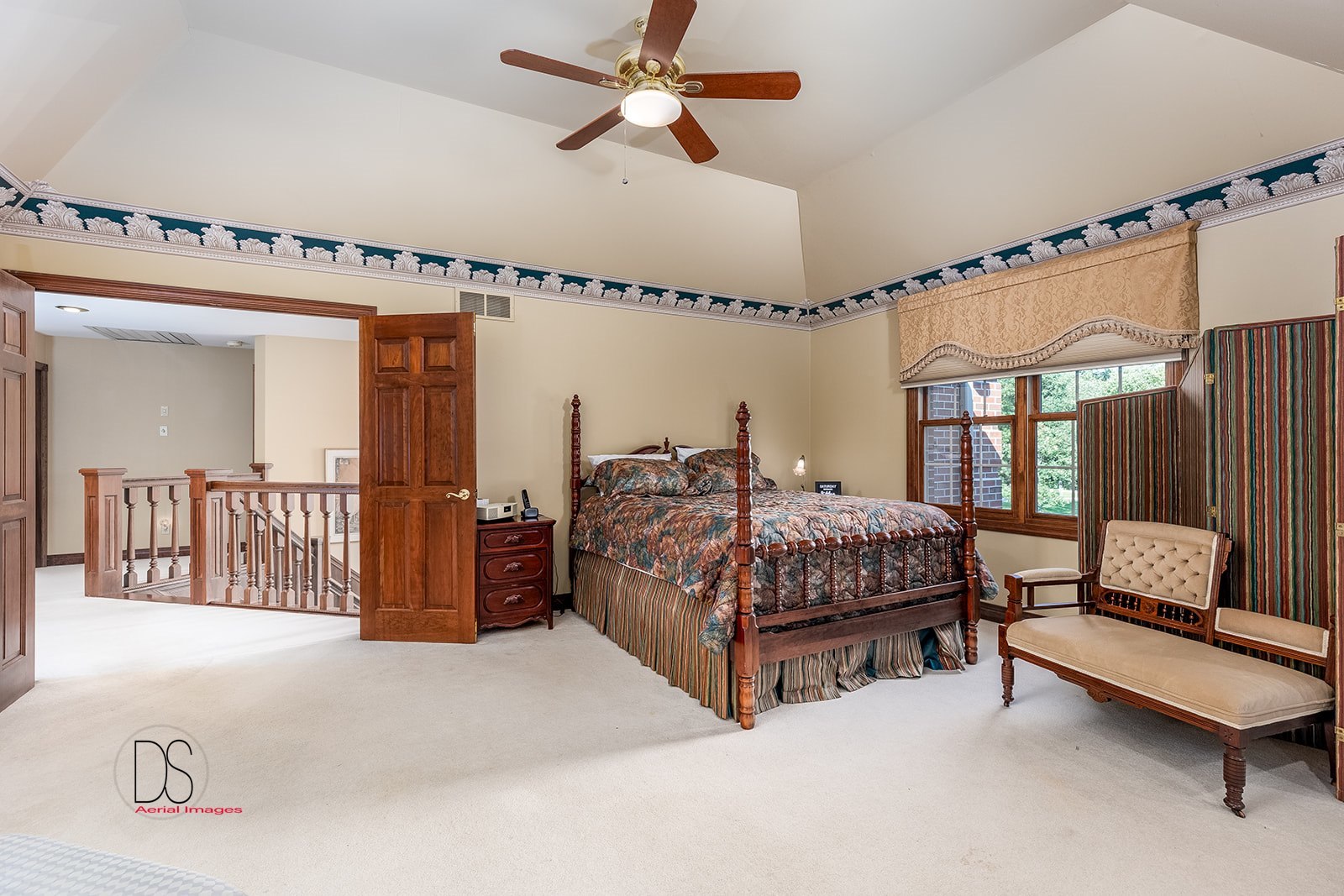 1638 Timber Lane Ottawa, IL 61350 - Photo 36 of 50 a bedroom with a bed a mirror and a window