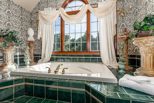 a view of an outdoor sitting area with brick walls