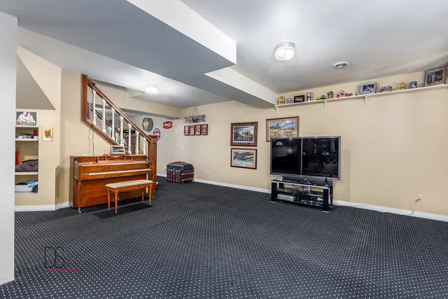 a room with stairs and a chair