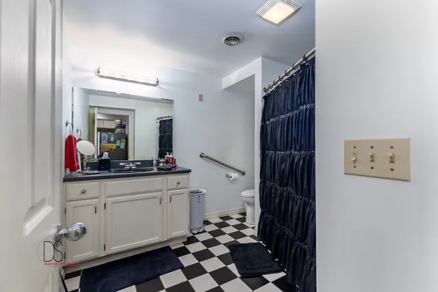 a bathroom with a sink a mirror and a shower