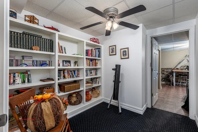 a view of a livingroom with furniture and workspace